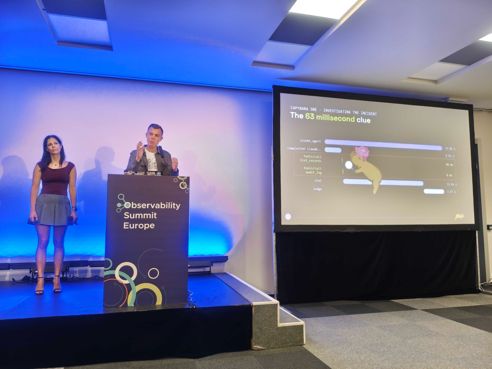 Kasper next to a slide titled The 63 millisecond clue, with a capybara holding a magnifying glass over the two short tool call spans in a 19 second agent trace