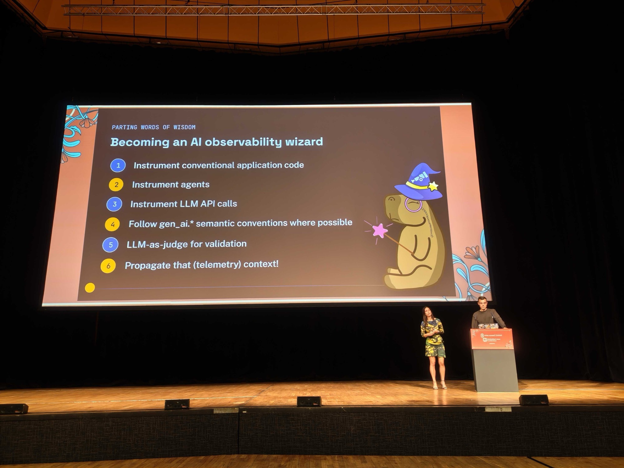 The Becoming an AI observability wizard slide listing six takeaways, with the two of us on stage