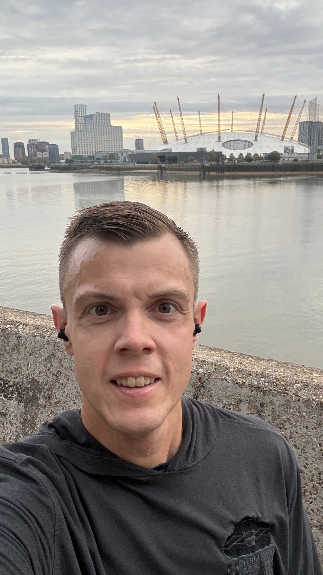 Kasper after a run along the Thames, with the O2 arena behind him
